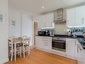 Kitchen with dining area | Coachman’s Cottage - Old Downs Farm, Sandwich Bay, near Sandwich