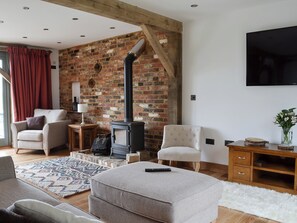 Living space with wood burner and exposed brick | Henry Oscar House, Winchelsea, near Rye