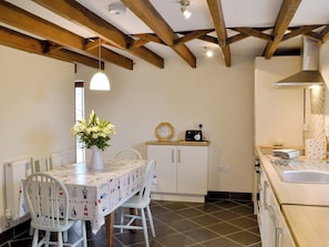 Kitchen/ dining room with beamed ceiling and slate floor | Beckaveans Granary - Beckaveans, Jacobstow, near Bude