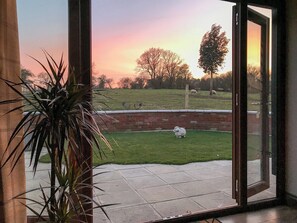 Patio doors leading to courtyard | Chick Hatch Barn, Carlton, near Saxmundham