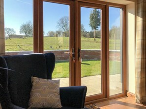 Patio doors leading to courtyard | Chick Hatch Barn, Carlton, near Saxmundham
