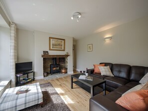 Living room with wood burning stove | Holliers Cottage, Middle Barton, near Chipping Norton