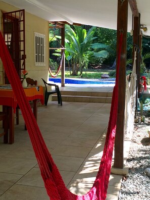 view of pool from covered terrace.