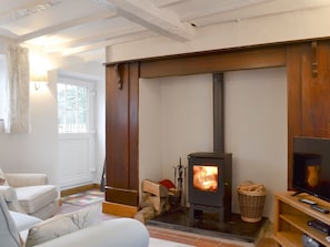 Warm, cosy living room with wood burner | Caeberllan, Llanfair Caereinion