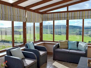 Conservatory with views of the surrounding countryside | The Hen Hoose, Langshaw, near Galashiels