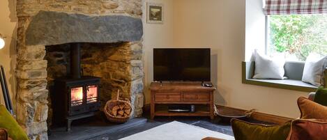 Cosy living room with wood burner & slate floor | Maybill Cottage, Cwm Penmachno, near Betws-y-Coed