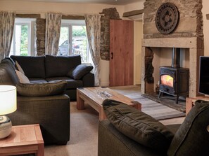 Thoughtfully furnished living room with Inglenook fireplace | Inglenook Cottage, Linton Falls, near Grassington