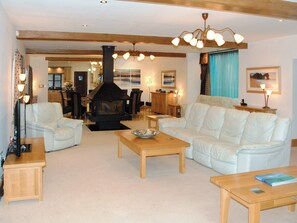 Spacious, light and airy lounge, with a modern central wood-burning stove | Orchard House - Chiddlecombe Holiday Cottages, Fairy Cross, Bideford