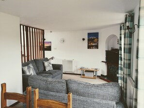 Living room with dining area | Capstan Cottage, Whitby
