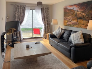 Relaxing lounge with 52” Sky HD TV with Netflix | Crossburn Hideaway, Arden, near Helensburgh