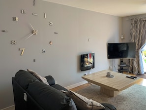 Comfortable lounge with 52” Sky HD TV with Netflix | Crossburn Hideaway, Arden, near Helensburgh