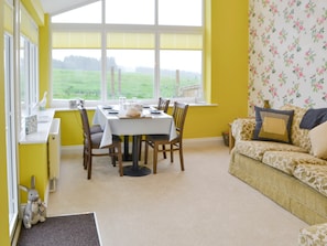 Large sunroom with dining and seating areas | Hazelnut Cottage - Holystone Estate, Farnham, near Rothbury