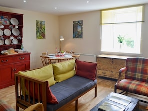 Relaxing living and dining room with multi-fuel burner | Brier Dene End Cottage - Brier Dene Farm Cottages, Old Hartley, near Whitley Bay 