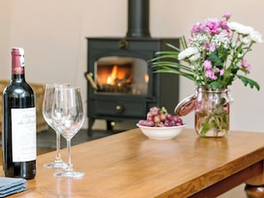 Cosy and inviting living room with wood burner | The Farmhouse at Higher Westwater Farm, Axminster