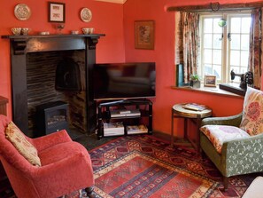 Warm and cosy living room with log effect electric fire | Downhouse - Downhouse Cottages, Trebarwith, near Delabole