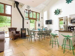 Cosy wood burner in the dining area | Campden Barn, Chipping Campden