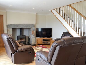 Beautifully presented living/dining room with cosy wood burner | Bwthyn Tyddyn Sachau, Y Ffôr, near Pwllheli