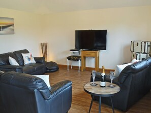 Welcoming living area with French doors to patio | Mill Stone Cottage - Mill Farm Cottages, Near Chapel St Leonards