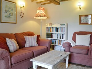 Comfortable seating area within living room | Apple Tree Cottage, Near Holt