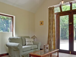 Thoughtfully renovated living room with woodburner | Waterfall Cottage - Lumsdale Cottages, Lumsdale, Tansley Wood, near Matlock