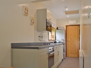 Galley style kitchen | Waterfall Cottage - Lumsdale Cottages, Lumsdale, Tansley Wood, near Matlock