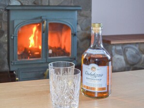 Relax in front of the cosy wood burner | Glebe Cottage, Urray, near Dingwall
