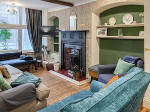 Lovely wood-floored living area with open fire | Nell’s Cottage, Bridlington