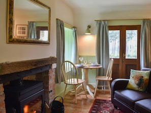 Cosy lounge with wood burner | St Orans, Dunphail, near Forres