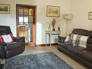 Warm and welcoming living room with open fire | Rose Cottage, Norham, near Berwick-upon-Tweed