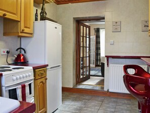 Immaculately presented kitchen with breakfast bar | Rose Cottage, Norham, near Berwick-upon-Tweed