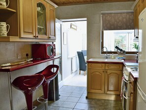Immaculately presented kitchen with breakfast bar | Rose Cottage, Norham, near Berwick-upon-Tweed