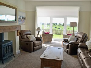 Spacious living room with patio doors | Wayside, Beadnell