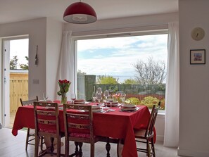 Dining area with patio doors leading to decking | Seaforth View, St Monans, near Anstruther
