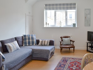 Comfortable living/ dining room | Dipper Cottage, Seahouses
