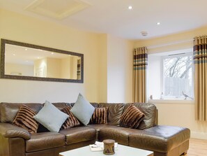 Comfy seating in living room | Kinneddar Cottage - Nether Kinneddar Lodge Cottages, Saline, near Dunfermline