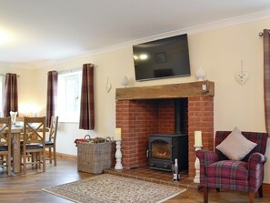 Homely living/ dining room with cosy wood burner | Castle View, Llananno, near Llandrindod Wells