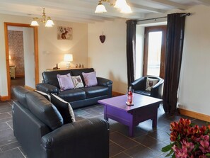 Spacious and warm living room with wood burner | Yr Hen Feudy - Bronallt Barns, Llanynghenedl, near Holyhead