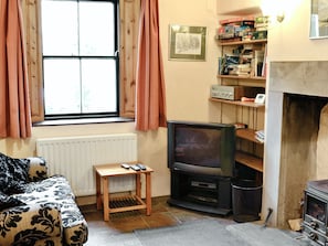 Cosy lounge with wood-burner | Langcliffe Lock Cottage, Langcliffe, near Settle