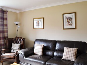 Comfortable leather sofas in the living room | Stags Neuk, Aviemore