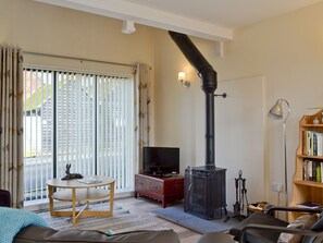 Charming lounge area with traditional log-burning stove | The Coop, Kirdford, near Petworth
