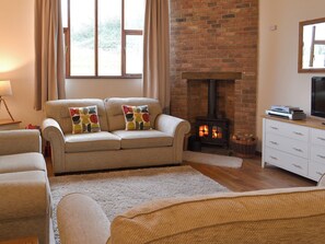Living room with wood burner | Rook - Newhouse Barton, Ipplepen, near Totnes