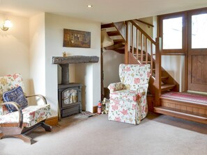 Spacious living room with wood-burner | The Coach House, Bootle, near Millom