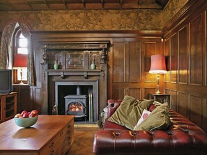 Large living room with wood-burning stove | Dunvarlich House, Aberfeldy