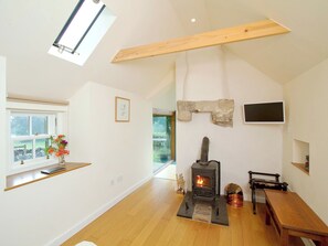 Living room with cosy wood-burning stove | Tullibole Castle Longhouse, Crook of Devon