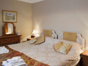Bedroom with zip and link super kingsize bed | Swallowtail Cottage - Studley House Farm Cottages, Ebberston, near Scarborough