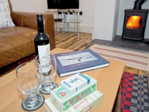 Spacious comfortable living room with wood burning stove | Ty· Cai - Ty Coch Chatham, Llandwrog, near Caernarfon
