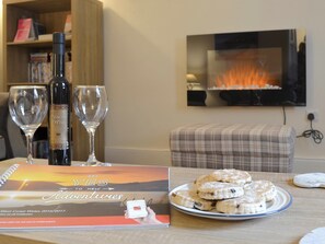 Stylish wall mounted fire in living room | Montrose, New Quay