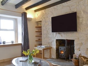 Welcoming living room with wood burner | Annies Cottage, Edinbane, near Portree