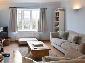 Living room with wood burning stove | Bramble Cottage, Craster, near Alnwick