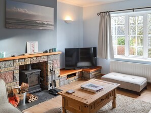 Living room with wood burning stove | Bramble Cottage, Craster, near Alnwick